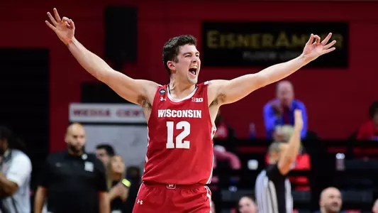 Trevor Anderson celebrates a 3-pointer at the buzzer before halftime during a game at Rutgers