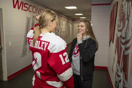 Grace Shirley and Emily Clark chat during an NCAA college women’s hockey game against the Penn State Nittany Lions Friday, Oct. 4, 2019, in Madison, Wis. The Badgers won 7-0. (Photo by David Stluka/Wisconsin Athletic Communications)