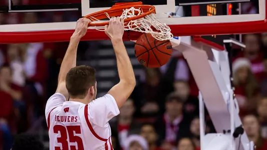 Nate Reuvers dunks during a game against Milwaukee