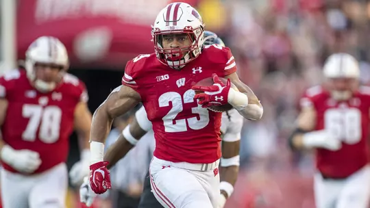 Wisconsin Badgers running back Jonathan Taylor (23) carries the ball during an NCAA college football game against the Purdue Boilermakers Saturday, Nov. 23, 2019, in Madison, Wis. The Badgers won 45-24. (Photo by David Stluka/Wisconsin Athletic Communications)