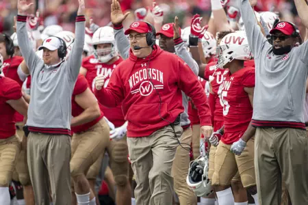 Wisconsin Badgers Head Coach Paul Chryst, center, celebrates touchdown during an NCAA Big Ten Conference college football game against the Northwestern Wildcats Saturday, Aug. 28, 2019, in Madison, Wis. The Badgers won 24-15. (Photo by David Stluka/Wisconsin Athletic Communications)