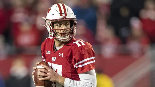 Wisconsin Badgers quarterback Jack Coan (17) looks for a receiver during an NCAA college football game against the Purdue Boilermakers Saturday, Nov. 23, 2019, in Madison, Wis. The Badgers won 45-24. (Photo by David Stluka/Wisconsin Athletic Communications)