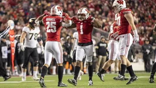 Wisconsin Badgers defensive back Faion Hicks (1) and Eric Burrell (25) celebrate during an NCAA college football game against the Purdue Boilermakers Saturday, Nov. 23, 2019, in Madison, Wis. The Badgers won 45-24. (Photo by David Stluka/Wisconsin Athletic Communications)