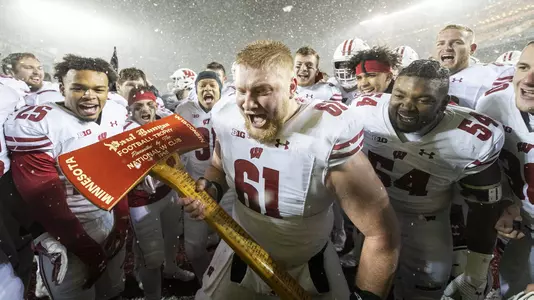 Wisconsin Badgers Tyler Biadasz celebrate with the Paul Bunyan Axe after an NCAA Big Ten Conference college football game against the Minnesota Golden Gophers Saturday, Nov. 30, 2019, in Minneapolis. The Badgers won 38-17. (Photo by David Stluka/Wisconsin Athletic Communications)