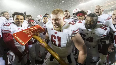 Wisconsin Badgers Tyler Biadasz celebrate with the Paul Bunyan Axe after an NCAA Big Ten Conference college football game against the Minnesota Golden Gophers Saturday, Nov. 30, 2019, in Minneapolis. The Badgers won 38-17. (Photo by David Stluka/Wisconsin Athletic Communications)