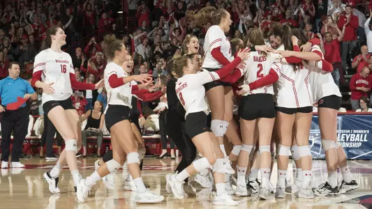 The Badgers rush the court after beating UCLA.