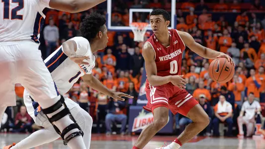 D'Mitrik Trice dribbles the ball during a game at Illinois