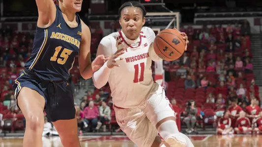 Marsha Howard drives to the basket against a Michigan defender