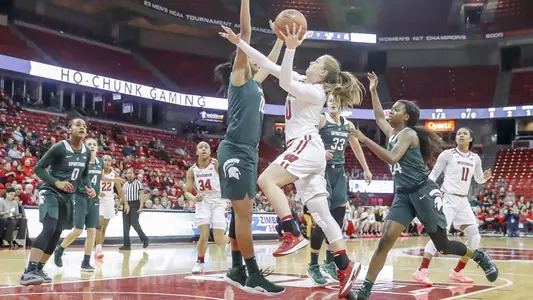 Kendra Van Leeuwen drives to the basket vs. a Michigan State defender.