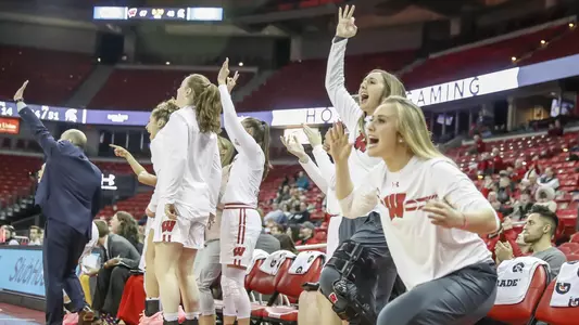 The Badger bench celebrates its win over No. 24 Michigan State.