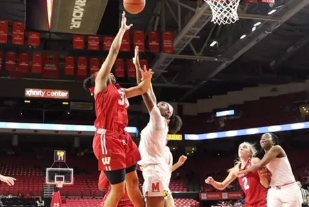 Imani Lewis shoots over a Maryland defender.
