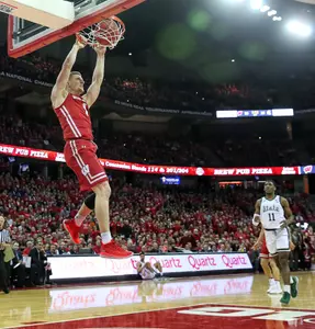 Brevin Pritzl men's basketball dunks the ball against Michigan State at the Kohl Center 2019