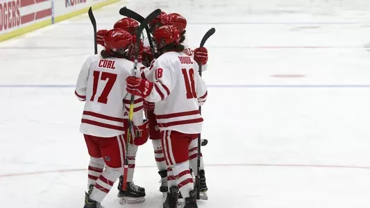 The Badgers celebrate following freshman Britta Curl's goal in  the second period of their game against St. Cloud State at LaBahn Arenavon March 1, 2019