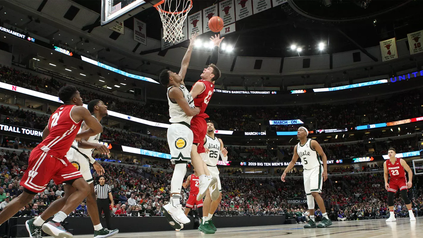 Ethan Happ goes for a layup during a Big Ten tournament game against Michigan State