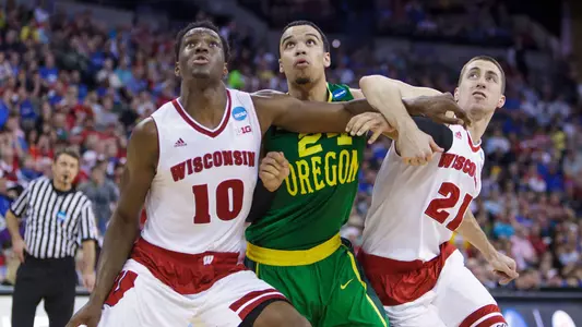 March 22, 2015: Wisconsin Badgers forward Nigel Hayes (10) and Wisconsin Badgers guard Josh Gasser (21) guard Oregon Ducks forward Dillon Brooks (24) during the Div I Men's Championship - Third Round - Wisconsin Badgers v Oregon Ducks at the Centurylink Center in Omaha, Nebraska.  Wisconsin defeated Oregon 72-65