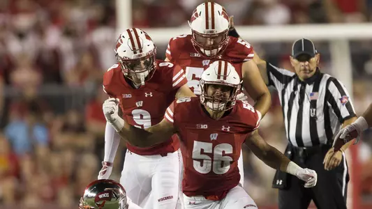 linebacker Zack Baun #56 reacts after tackling Western Kentucky quarterback Drew Eckels #4 during the NCAA Football game between the Western Kentucky Hilltoppers and the Wisconsin Badgers at Camp Randall Stadium in Madison, WI.