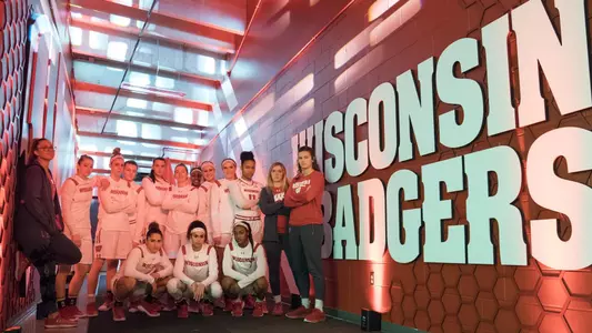 2018-19 team photo of the Badgers in the tunnel outside of the Kohl Center floor