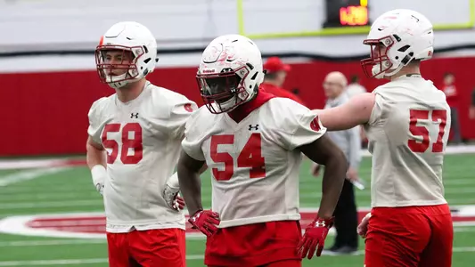 Mike Maskalunas (58), Chris Orr (54) and Jack Sanborn (57) at spring practice in the McClain Center 2019