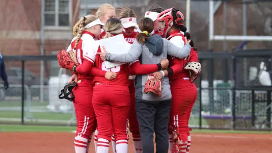 Softball team huddle at Northwestern