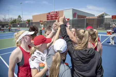 women's tennis team huddle at Nielsen Tennis Stadium 2019