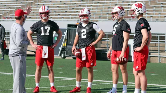 Wisconsin football quarterbacks coach Jon Budmayr talks to the four quarterbacks Danny Vanden Boom, Jack Coan, Graham Mertz and Chase Wolf at spring practice inside Camp Randall Stadium 2019