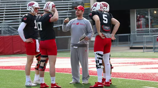 Wisconsin football quarterbacks coach Jon Budmayr talks to the four quarterbacks Danny Vanden Boom, Jack Coan, Graham Mertz and Chase Wolf at spring practice inside Camp Randall Stadium 2019