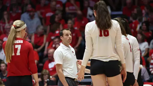 Gary White talks with the Badgers on the sideline