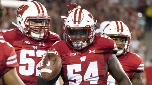 Wisconsin Badgers linebacker Chris Orr (54) celebrates a turnover with teammates during an NCAA college football game against the Western Kentucky Hilltoppers Friday, August 31, 2018, in Madison, Wisconsin. The Badgers won 34-3. (Photo by David Stluka)