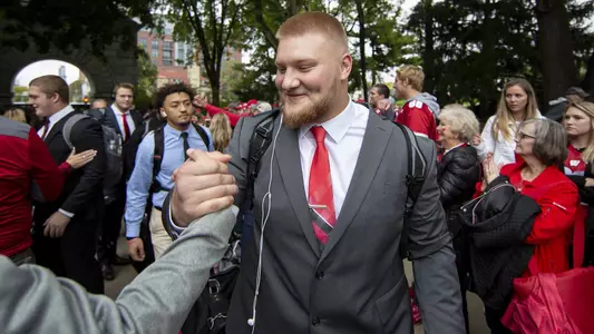 Wisconsin Badgers offensive lineman Tyler Biadasz (61) is greeted by fans as the team walks to the stadium before the game against Nebraska. The Wisconsin Badgers host Nebraska at Camp Randall Stadium on October 6, 2018 in Madison Wisconsin.Photo by Tom Lynn/Wisconsin Athletic Communications
