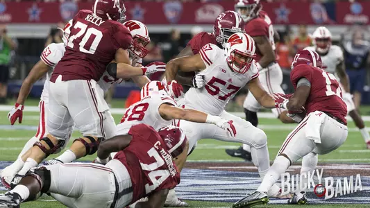 Wisconsin Badgers defensive lineman Alec James (57) makes a tackle during the Advocare Classic NCAA college football game against the Alabama Crimson Tide Saturday, September 5, 2015, in Arlington, Texas. The Crimson Tide beat the Badgers 35-17. (Photo by David Stluka)