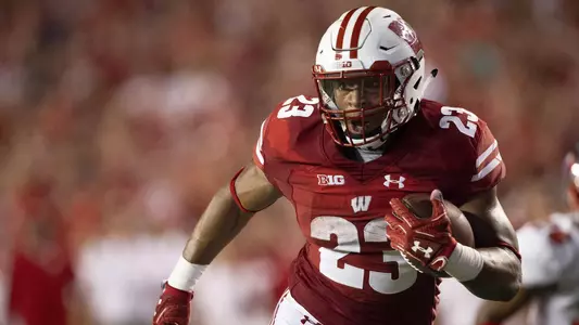 Jonathan Taylor breaks away for extra yards in the first-half. University of Wisconsin-Madison football team faces Western Kentucky at Camp Randall Field, August 31, 2018 in Madison Wisconsin.Photo by Tom Lynn/Wisconsin Athletic Communications