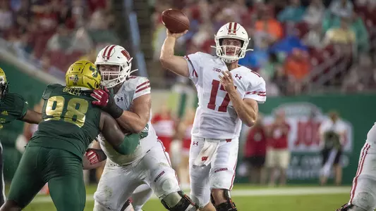 Jack Coan throws the ball against South Florida, August 30, 2019