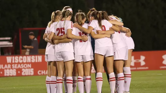 Women's soccer huddle against Marquette