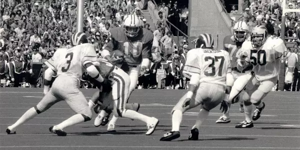 Quarterback Jess Cole carries the ball vs. Michigan inside Camp Randall Stadium 1981