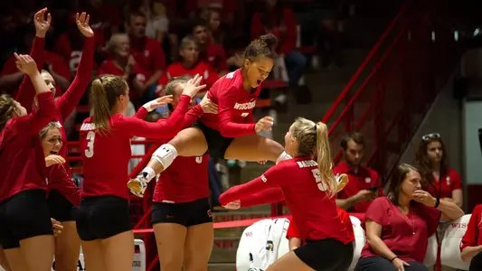 The Badger bench celebrates during a match.
