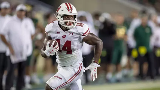 Wisconsin Badgers running back Nakia Watson (14) scores a touchdown during an NCAA college football game against the USF Bulls Saturday, Sept. 30, 2019, in Tampa Bay, Florida. The Badgers won 49-0. (Photo by David Stluka/Wisconsin Athletic Communications)