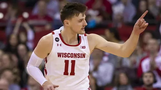 Wisconsin Badgers forward Micah Potter #11 gives credit for a pass and score during the NCAA Basketball game between the Milwaukee Panthers and the Wisconsin Badgers at the Kohl Center in Madison, WI. John Fisher/CSM(Credit Image: © John Fisher/Cal Sport Media)