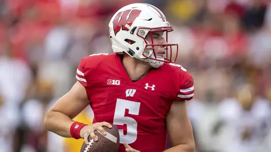 Wisconsin Badgers quarterback Graham Mertz (5) rolls out of the pocket during an NCAA college football game against Central Michigan Chippewas Saturday, Aug. 7, 2019, in Madison, Wis. The Badgers won 61-0. (Photo by David Stluka/Wisconsin Athletic Communications)