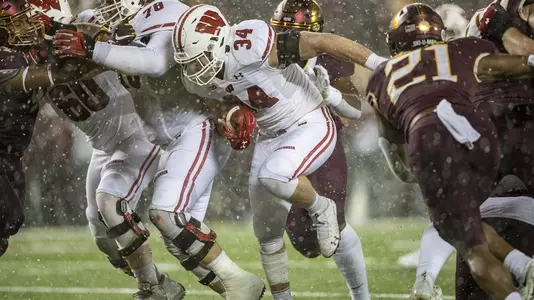 Wisconsin Badgers full back Mason Stokke (34) carries the ball during an NCAA Big Ten Conference college football game against the Minnesota Golden Gophers Saturday, Nov. 30, 2019, in Minneapolis. The Badgers won 38-17. (Photo by David Stluka/Wisconsin Athletic Communications)