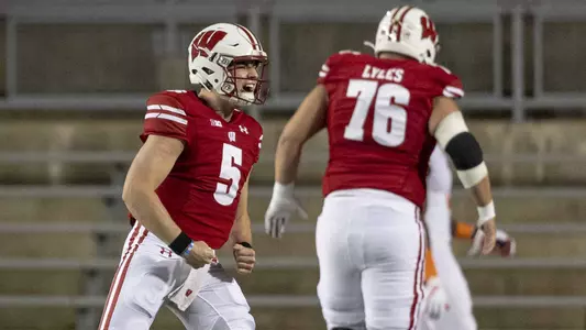 Wisconsin Badgers' quarterback Graham Mertz (5) throws a pass during an NCAA college football game against Illinois Friday October 23, 2020 in Madison, WI.  Photo by Tom Lynn/Wisconsin Athletic Communications