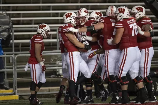Wisconsin Badgers touchdown celebration during an NCAA college football game against the Illinois Fighting Illini Friday, Oct. 23, 2020, in Madison, Wis. The Badgers won 45-7. (Photo by David Stluka/Wisconsin Athletic Communications)