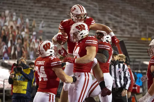 Wisconsin Badgers tight end Jake Ferguson (84) celebrates a touchdown reception with teammates during an NCAA college football game against the Illinois Fighting Illini Friday, Oct. 23, 2020, in Madison, Wis. The Badgers won 45-7. (Photo by David Stluka/Wisconsin Athletic Communications)