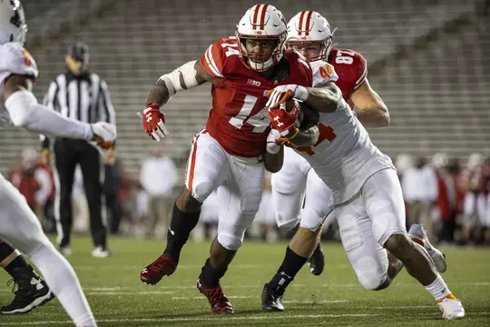 Wisconsin Badgers running back Nakia Watson (14) carries the ball during an NCAA college football game against the Illinois Fighting Illini Friday, Oct. 23, 2020, in Madison, Wis. The Badgers won 45-7. (Photo by David Stluka/Wisconsin Athletic Communications)
