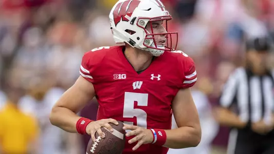 Wisconsin Badgers quarterback Graham Mertz (5) rolls out of the pocket during an NCAA college football game against Central Michigan Chippewas Saturday, Aug. 7, 2019, in Madison, Wis. The Badgers won 61-0. (Photo by David Stluka/Wisconsin Athletic Communications)