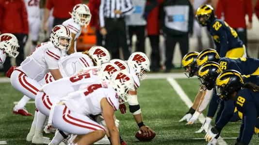 Wisconsin offensive line and QB Graham Mertz at line of scrimmage against Michigan on Saturday, Nov. 14, 2020 in Ann Arbor, Mich.