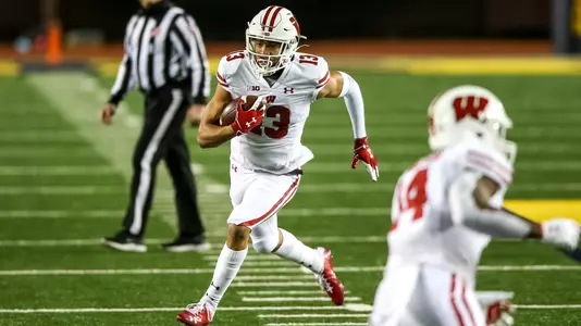Wisconsin Badgers' wide receiver Chimere Dike (13) carries the ball during an NCAA college football game against the Michigan Wolverines Saturday, Nov. 14, 2020, in Ann Arbor, Mich. The Badgers won 49-11. (Photo by Darren Lee/Wisconsin Athletic Communications)