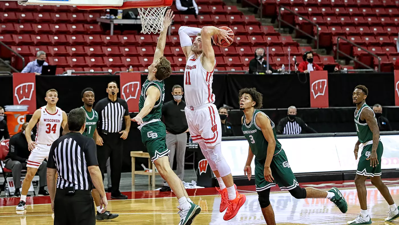 Micah Potter dunks the ball against Green Bay