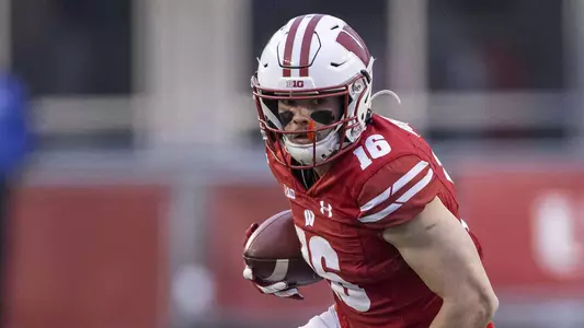 Wisconsin Badgers wide receiver Jack Dunn (16) carries the ball during an NCAA college football game against the Minnesota Golden Gophers Saturday, Dec. 19, 2020, in Madison, Wis. The Badgers won 20-17 in overtime. (Photo by David Stluka/Wisconsin Athletic Communications)