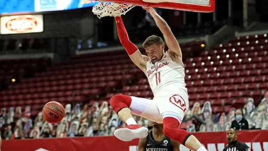 Micah Potter finishes a dunk vs. Minnesota