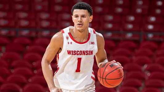 Johnny Davis dribbles the basketball during a game vs. Arkansas-Pine Bluff